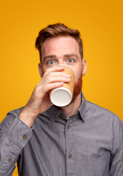 istock Adult man drinking coffee in morning 1309569245