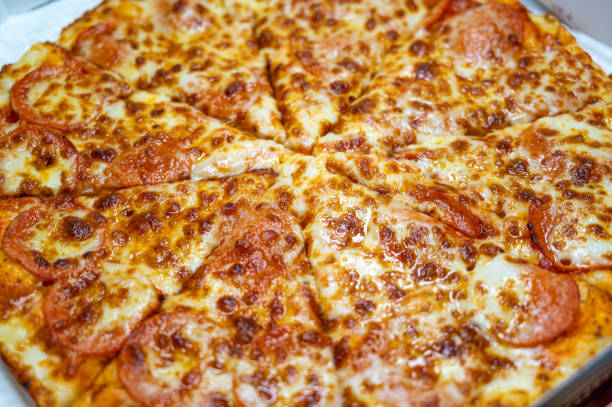 istock Thinly sliced pepperoni is a popular pizza 1309570602