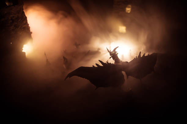 istock Battle between dragon and heroic soldiers. Creative table decoration. Selective focus 1309574350