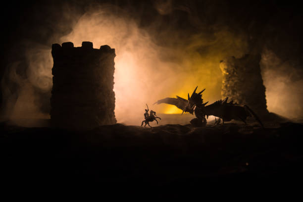 istock Battle between dragon and heroic soldiers. Creative table decoration. Selective focus 1309574355