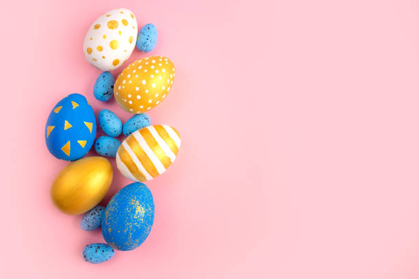 istock eggs golden and blue on modern beautiful pink paper 1309578890