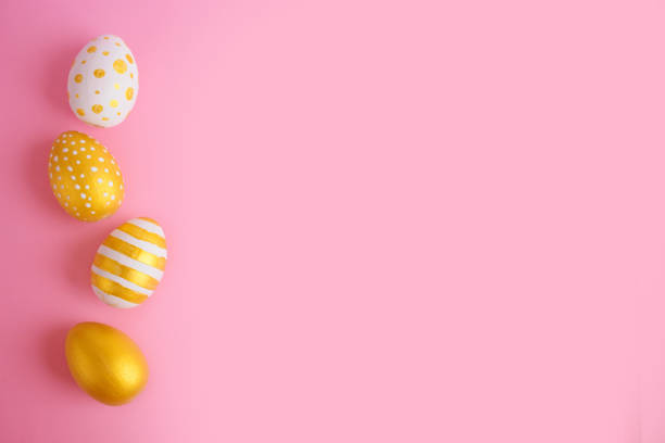 istock eggs golden and blue on modern beautiful pink paper 1309578986