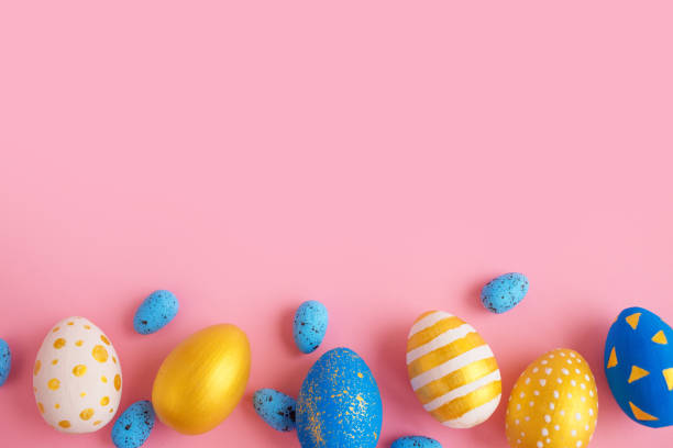 istock eggs golden and blue on modern beautiful pink paper 1309579000