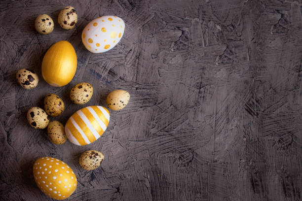istock Easter decoration golden Eggs on Dark Shale Background 1309579018