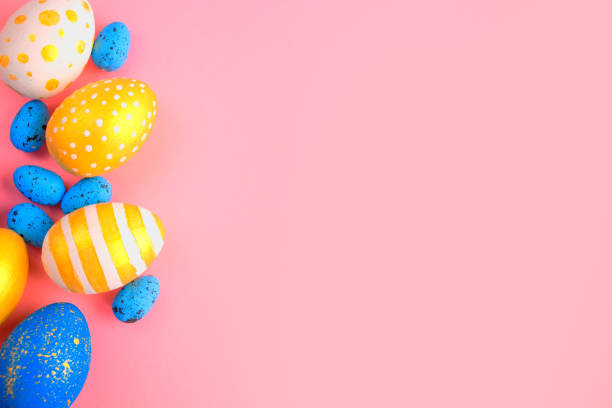istock eggs golden and blue on modern beautiful pink paper 1309579020