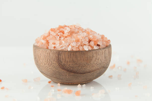 istock Pink salt from the Himalayas; photo on white background. 1309580013