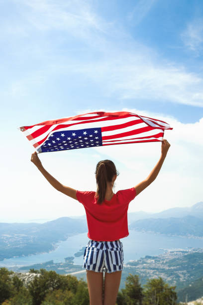 istock Girl is waving American flag 1309580037