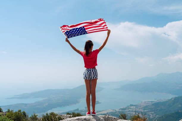 istock Girl is waving American flag 1309580047