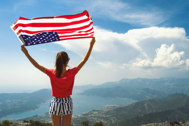 istock Girl is waving American flag 1309580061