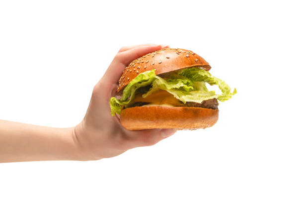 istock Hamburger in woman hands isolated on a white background. 1309581383