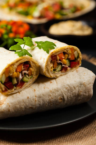 istock Tortilla with vegetables and hummus with chickpeas. 1309581762