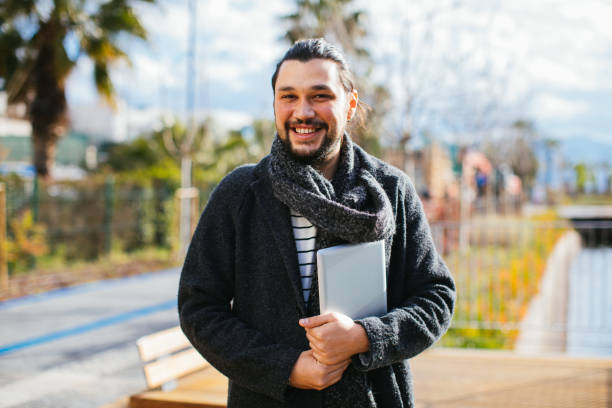 istock Young Man With Digital Tablet In Sunny Weather 1309582725