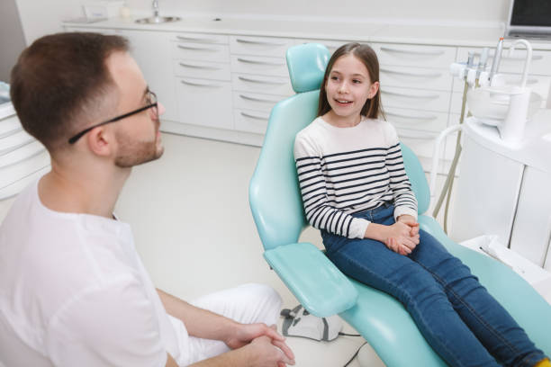 istock Young girl getting dental treatment 1309589050