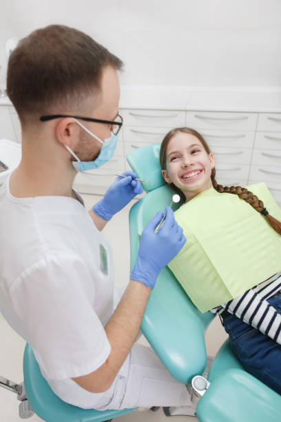istock Young girl getting dental treatment 1309589105