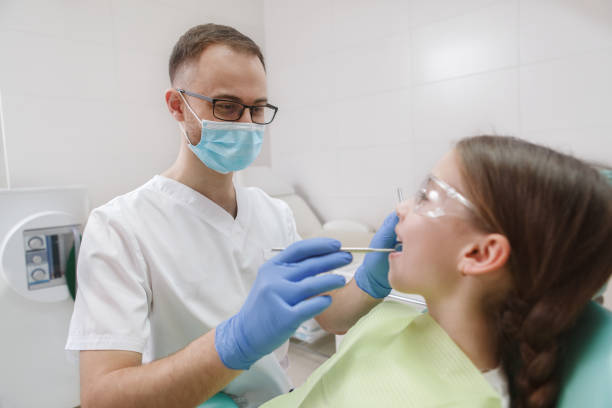istock Young girl getting dental treatment 1309589176
