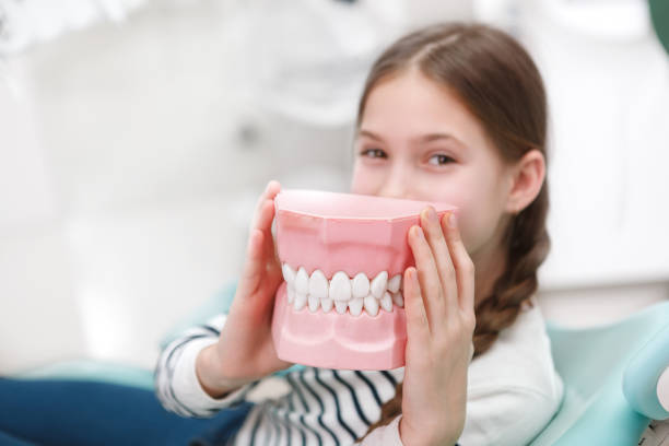 istock Young girl getting dental treatment 1309589224