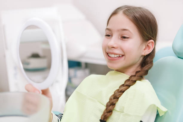 istock Young girl getting dental treatment 1309589260
