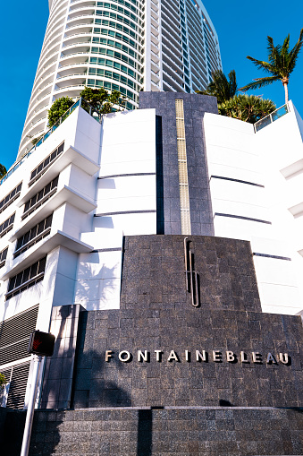 Miami Beach, USA - May 5, 2018: Fountainbleau luxury resort spa hotel sign on water fountain on Collins avenue at Miami Beach, Florida in summer