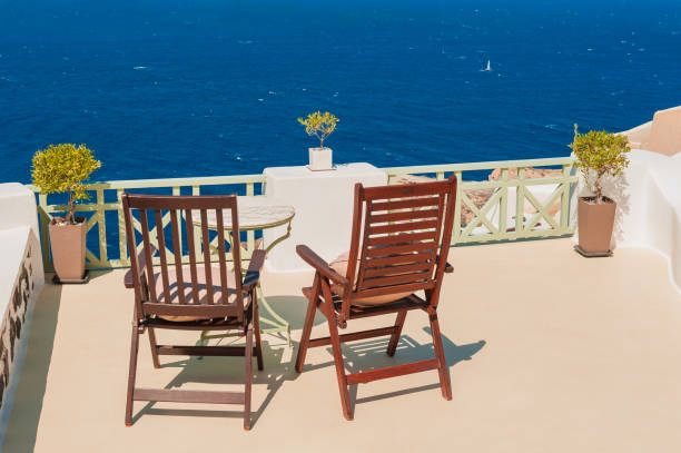 istock Two chairs on the terrace with sea view 1309591491