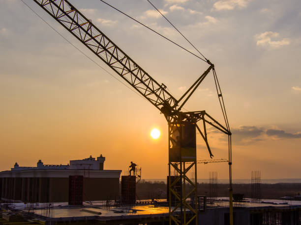 istock Sunset and construction, aerial, drone photo, crane 1309591610