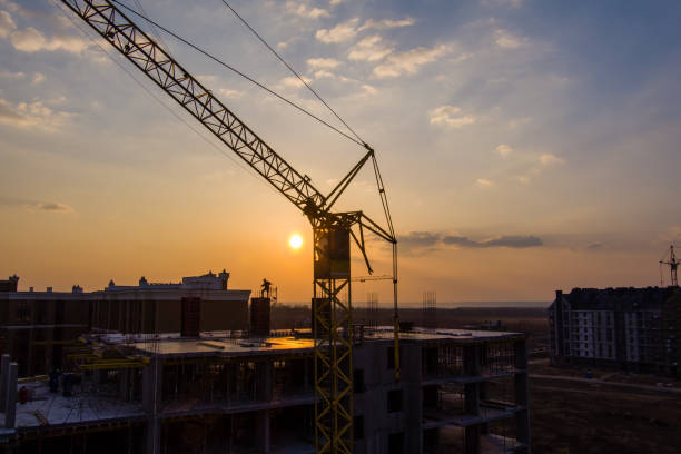 istock Sunset and construction, aerial, drone photo, crane 1309591611