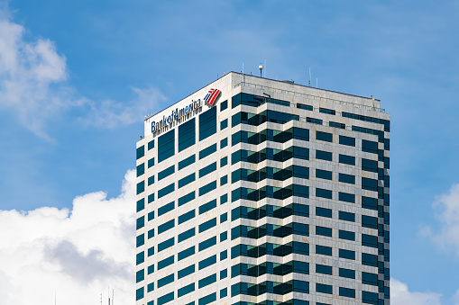 Tampa, USA - April 27, 2018: Bank of America Florida skyscraper tower corporate office building with logo sign isolated against blue cloudy sunny sky