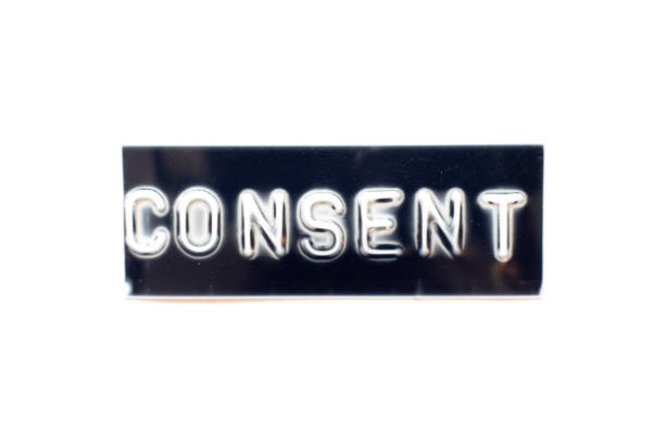 istock Embossed letter in word consent on black banner with white background 1309592472
