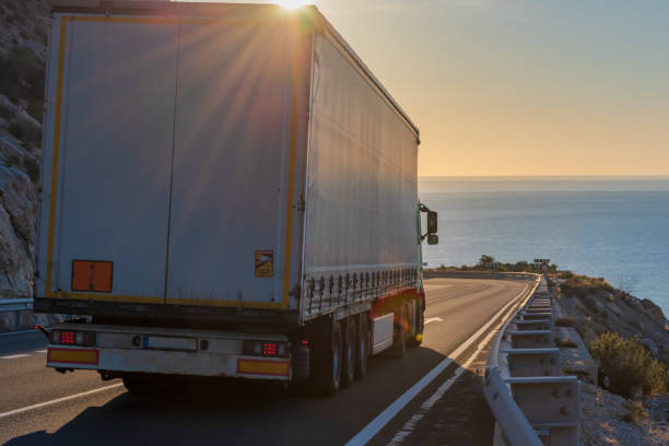 istock Truck on a mountain road 1309597346