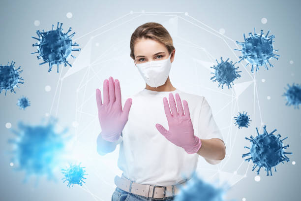 istock Woman in protective mask and gloves, blue coronavirus 1309598030
