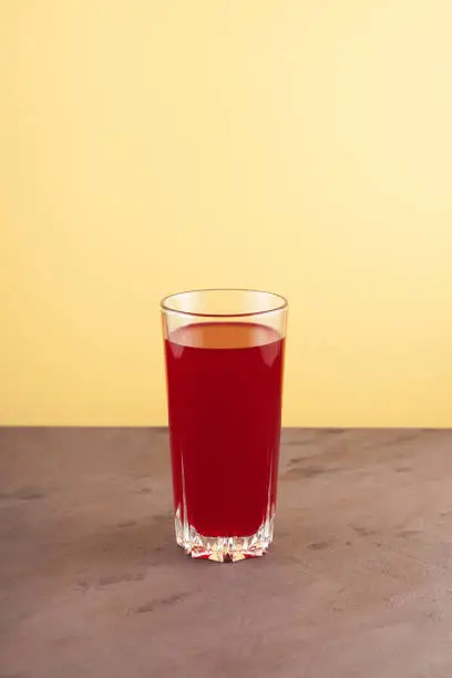 Photo of Salgam in drinking glass. Popular Turkish fermented drink, made from fermented purple carrots, turnips or beets