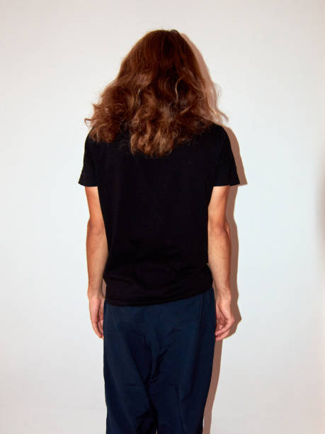 istock A back view of man with long hair standing on a white background 1309598192