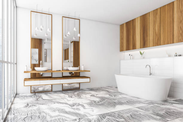 istock White and wooden bathroom with two sinks and bathtub on tiled marble floor 1309598255