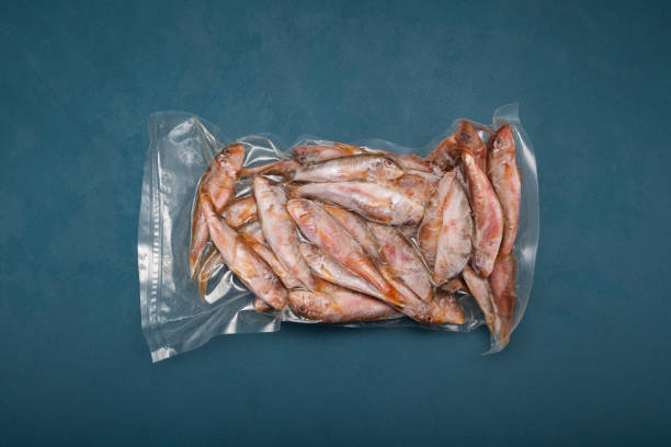 istock Frozen fish Mullus barbatus (red mullet) in pack. Top view, copy space 1309598257
