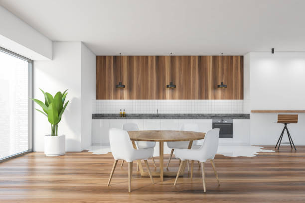 istock Modern kitchen interior with copy space on white wall, wooden countertops with a built in sink and a cooker. mock up. 1309600182