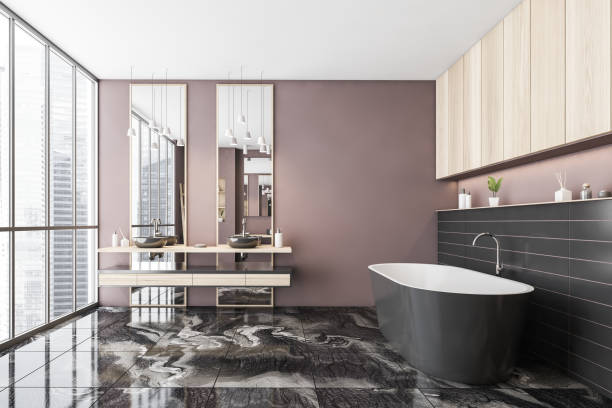 istock Black and pink bathroom with two sinks and bathtub on tiled marble floor 1309600536