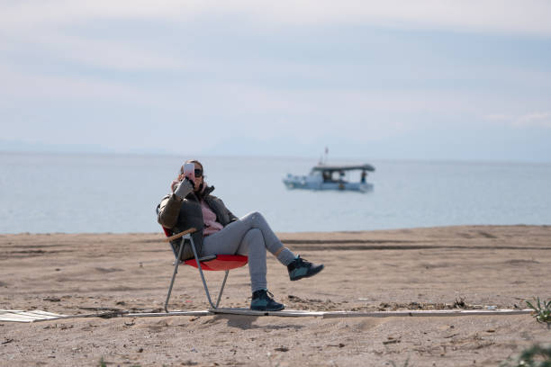 istock Woman traveler making selfie on the beach 1309600890