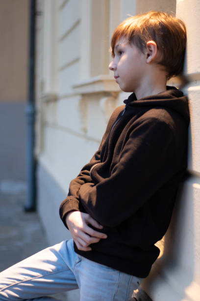 istock Blond boy portrait with defocused background 1309603166