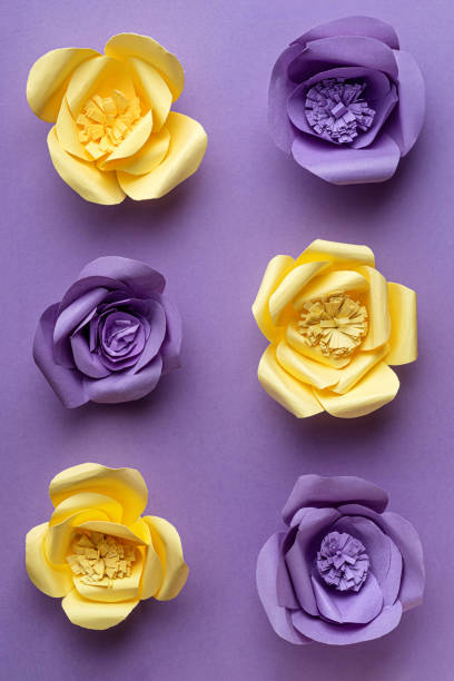 istock Paper Flowers on Purple Background 1309603238