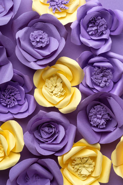 istock Paper Flowers on Purple Background 1309603292