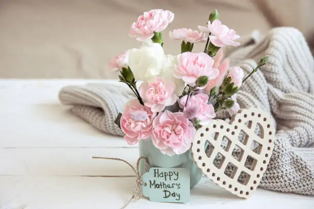 Photo of Cozy spring still life with fresh flowers for mother's day.