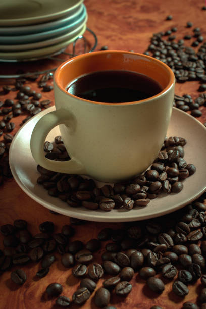 istock Cup of coffee and coffee beans 1309606143