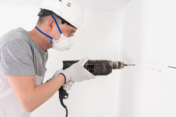 istock a worker installs a suspension system for kitchen furniture 1309606667