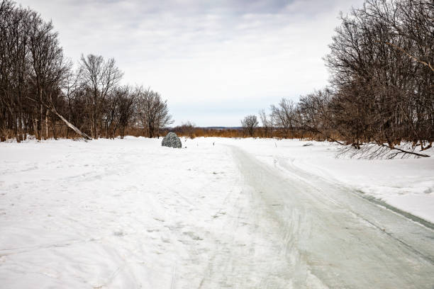 istock Angler sheltered from the cold and from the wind 1309610888