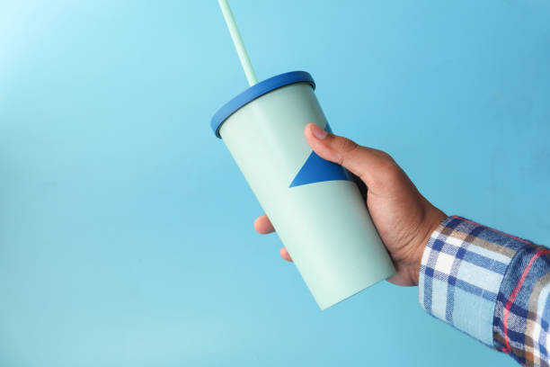 istock hand holding reusable eco coffee cup close up 1309612914