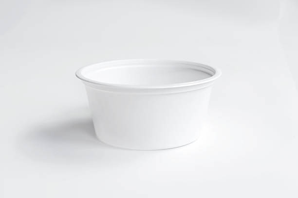istock White plastic cup disposable catchup bowl isolated on white background. Front view, mockup 1309613532