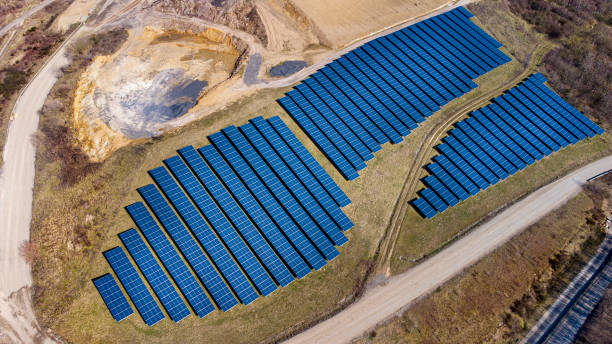 istock Solar panels - solar power plant - aerial view 1309614893