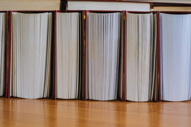 istock A row of half-open books lying on the desk 1309614924