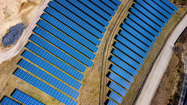 istock Solar panels - solar power plant - aerial view 1309614935