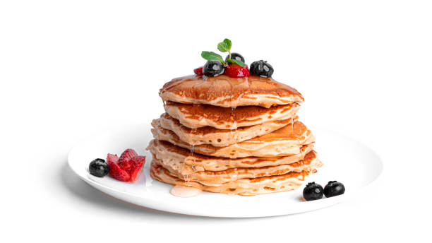 istock Pancakes with berries isolated on a white background 1309616185