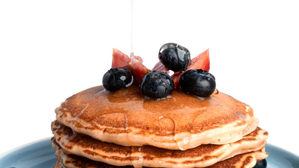 istock Pancakes with berries isolated on a white background 1309617131